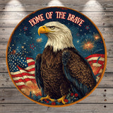 a bald eagle with its wings spread wide, surrounded by fireworks and the American flag, with the text "HOME OF THE BRAVE" written above it.