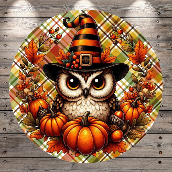 A whimsical illustration of an owl wearing a witch's hat, surrounded by autumnal elements such as pumpkins, acorns, and leaves, all set against a plaid background.
