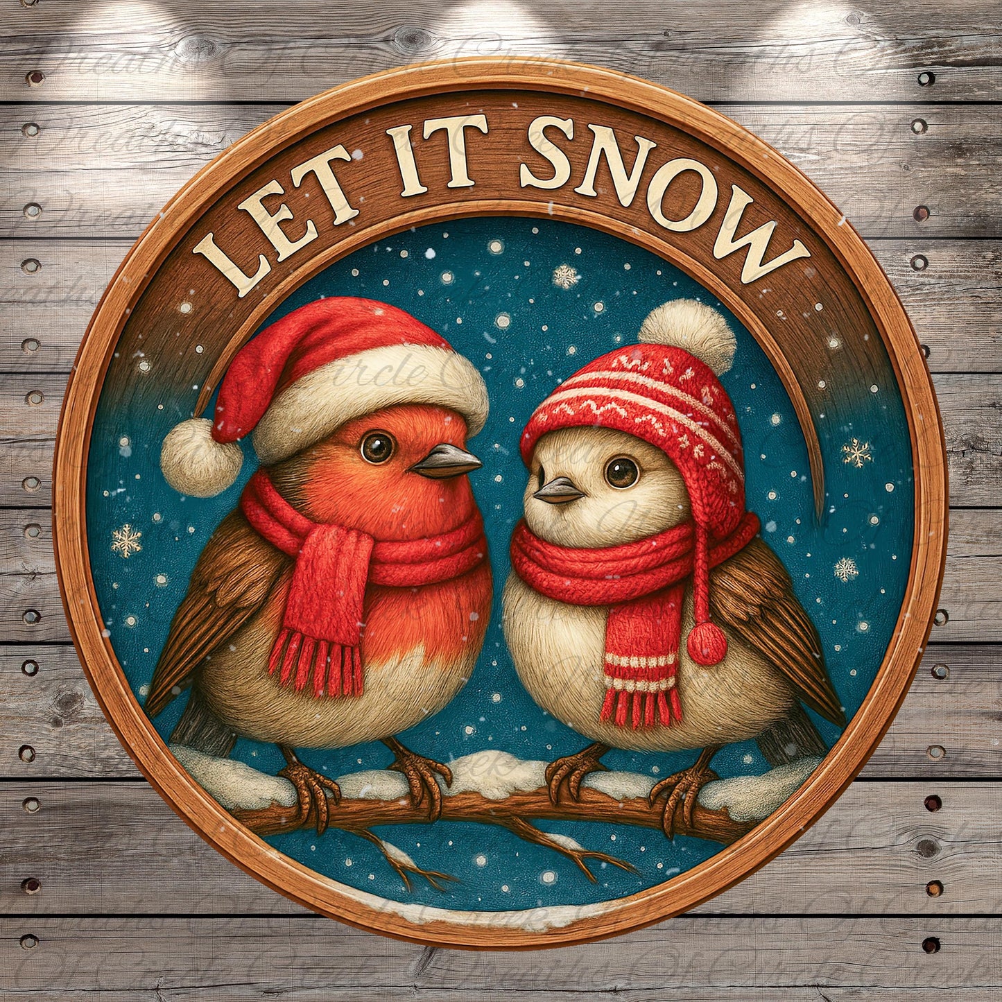 A circular wooden frame with a snowy winter scene inside, featuring two birds wearing red and white scarves and hats, with the text "LET IT SNOW" above them.