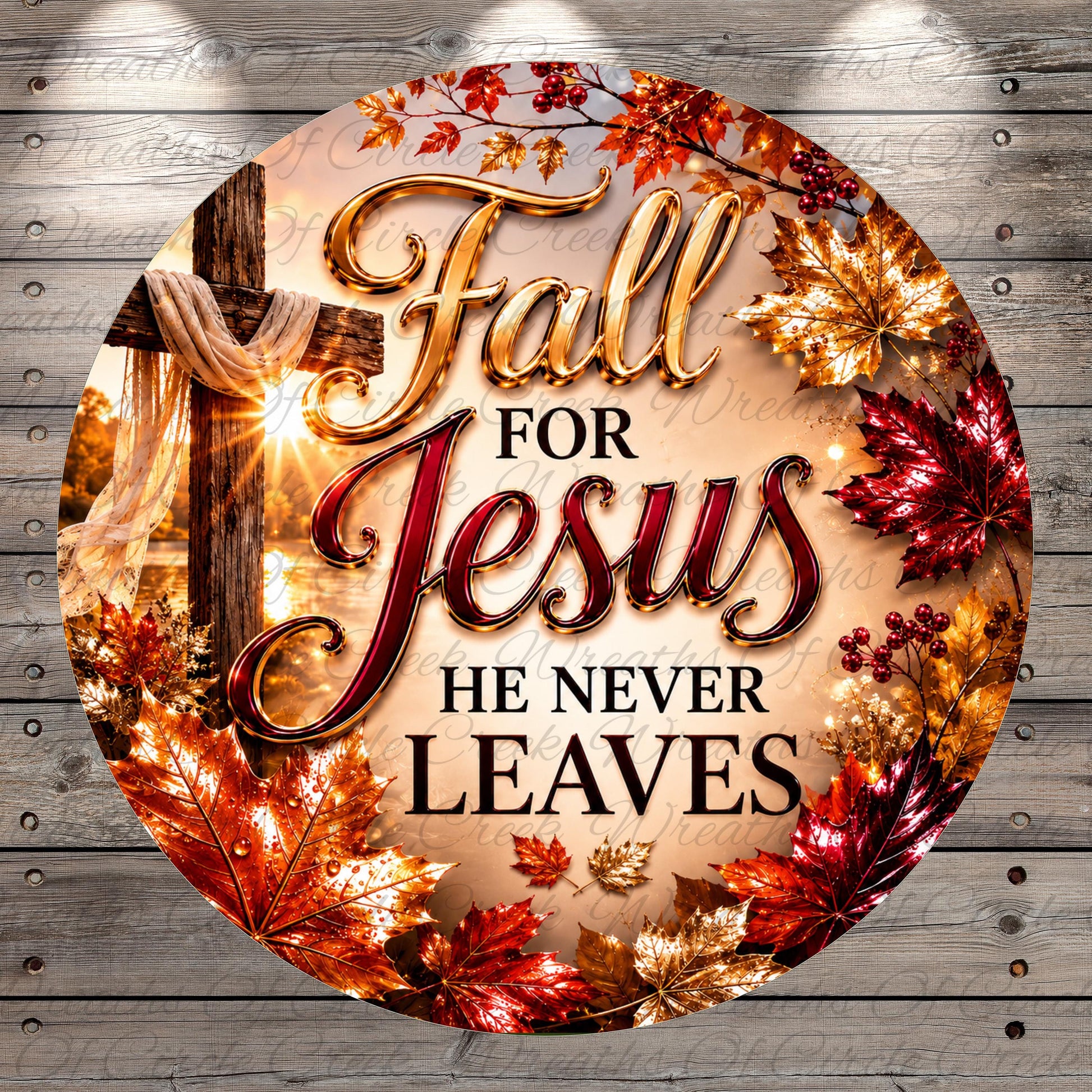 The image is a circular graphic with a wooden background and a cross, surrounded by autumn leaves in shades of red, orange, and gold. The text "Fall for Jesus he never leaves" is prominently displayed in the center of the image.