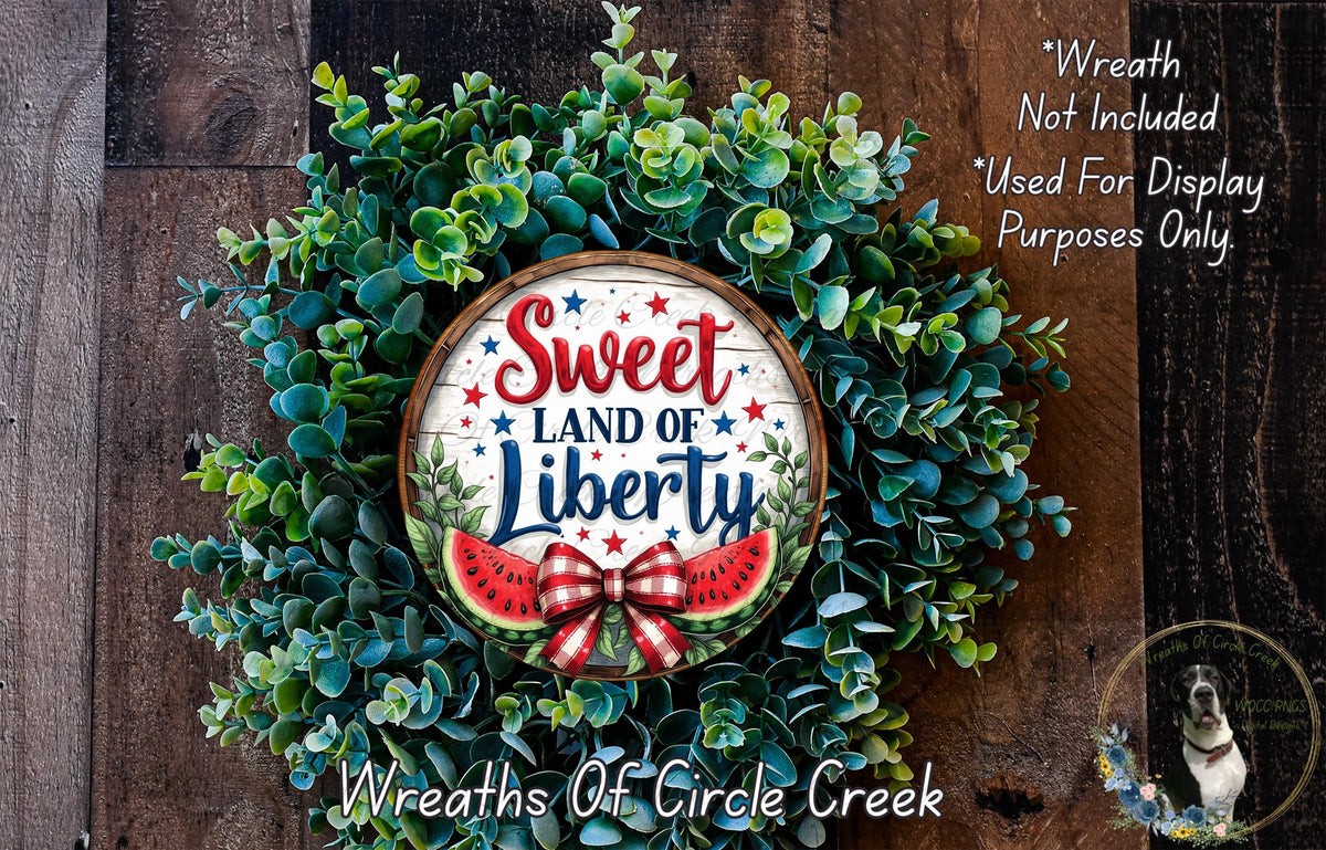 a wreath with the words sweet land of liberty painted on it