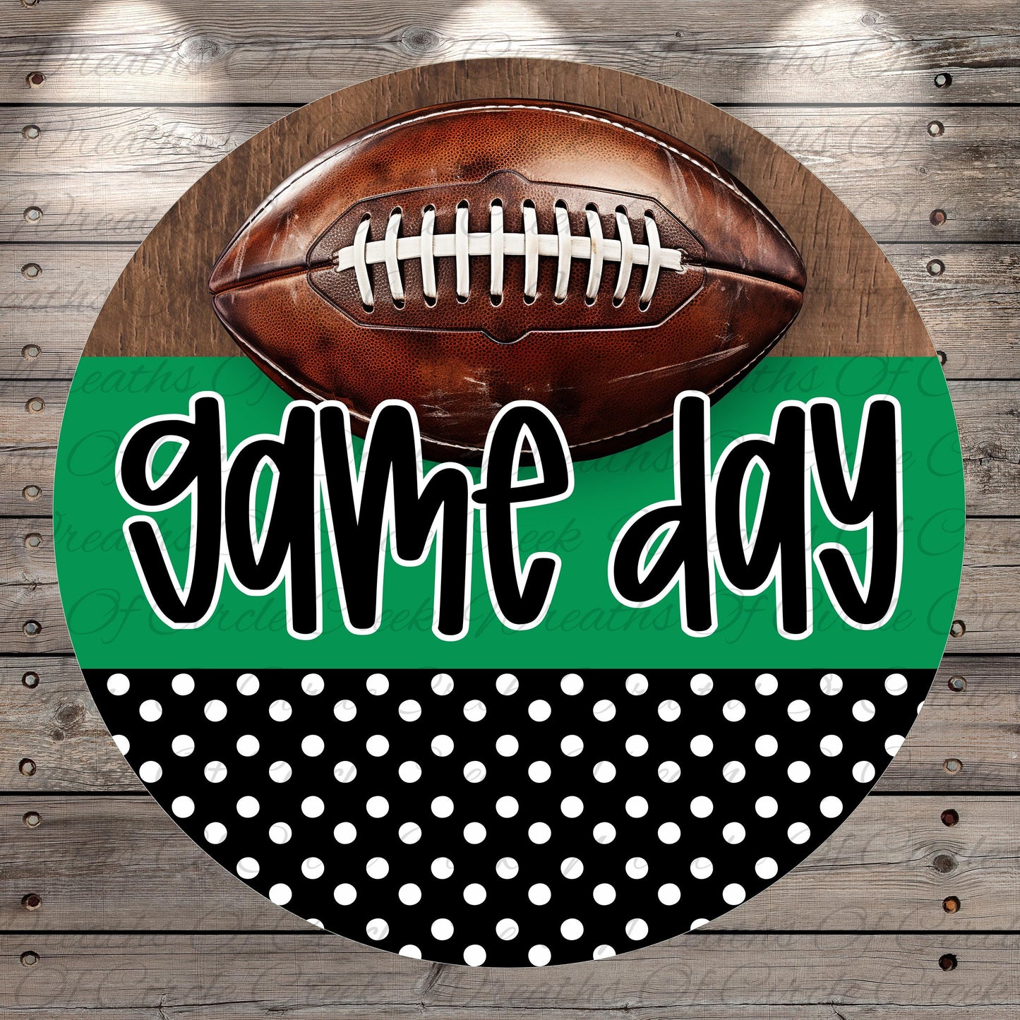 A football is placed on top of a green and black polka dot background with the text "game day" written in a stylized font.