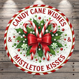 A circular Christmas-themed decoration with candy canes, mistletoe, and a red bow.