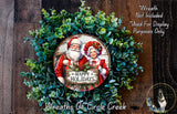 A wreath made of green leaves and featuring a Santa Claus and Granny Claus holding a sign that says "Happy Holidays".
