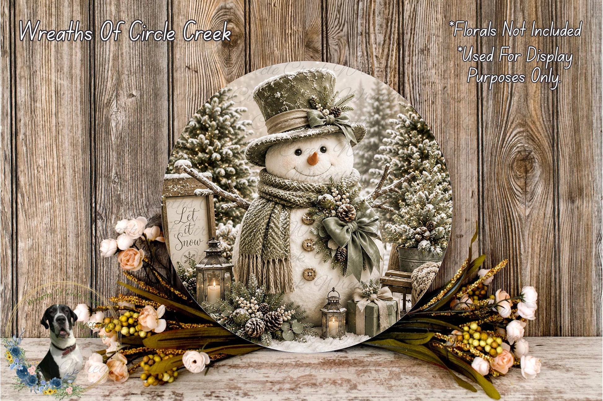A snowman decoration with a lantern, presents, and flowers is displayed on a wooden surface.