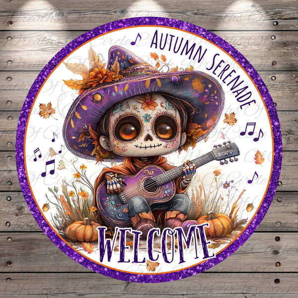 A colorful illustration of a skeleton wearing a purple hat and playing a guitar, surrounded by autumn leaves and flowers, with the text "Autumn Serendade" and "Welcome" at the bottom.