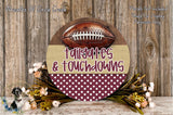 a decorative sign with a football and the words "tailgates & touchdowns" written on it, surrounded by a floral arrangement and a wooden background.