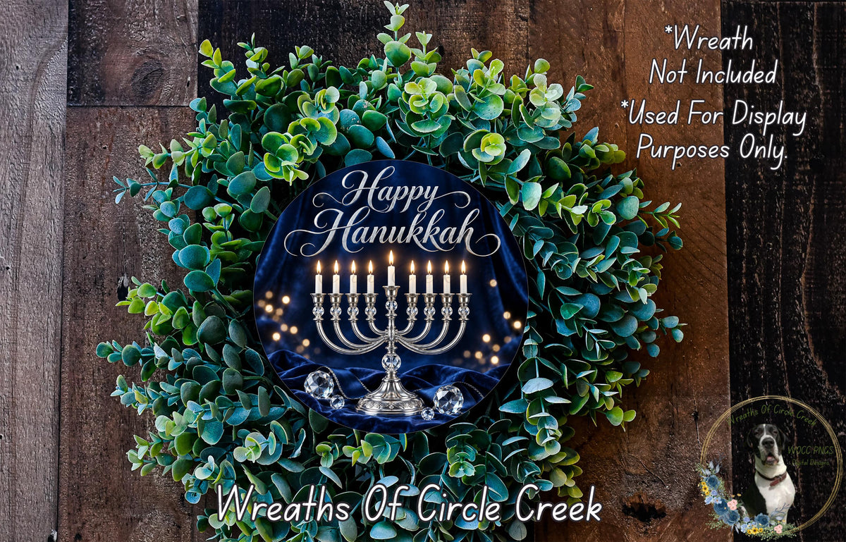 A wreath made of green leaves and a blue circular design with a menorah and candles, representing the Hanukkah holiday.