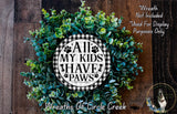 A wreath made of green leaves and a circular sign with the text "All My Kids Have Paws" in the center.