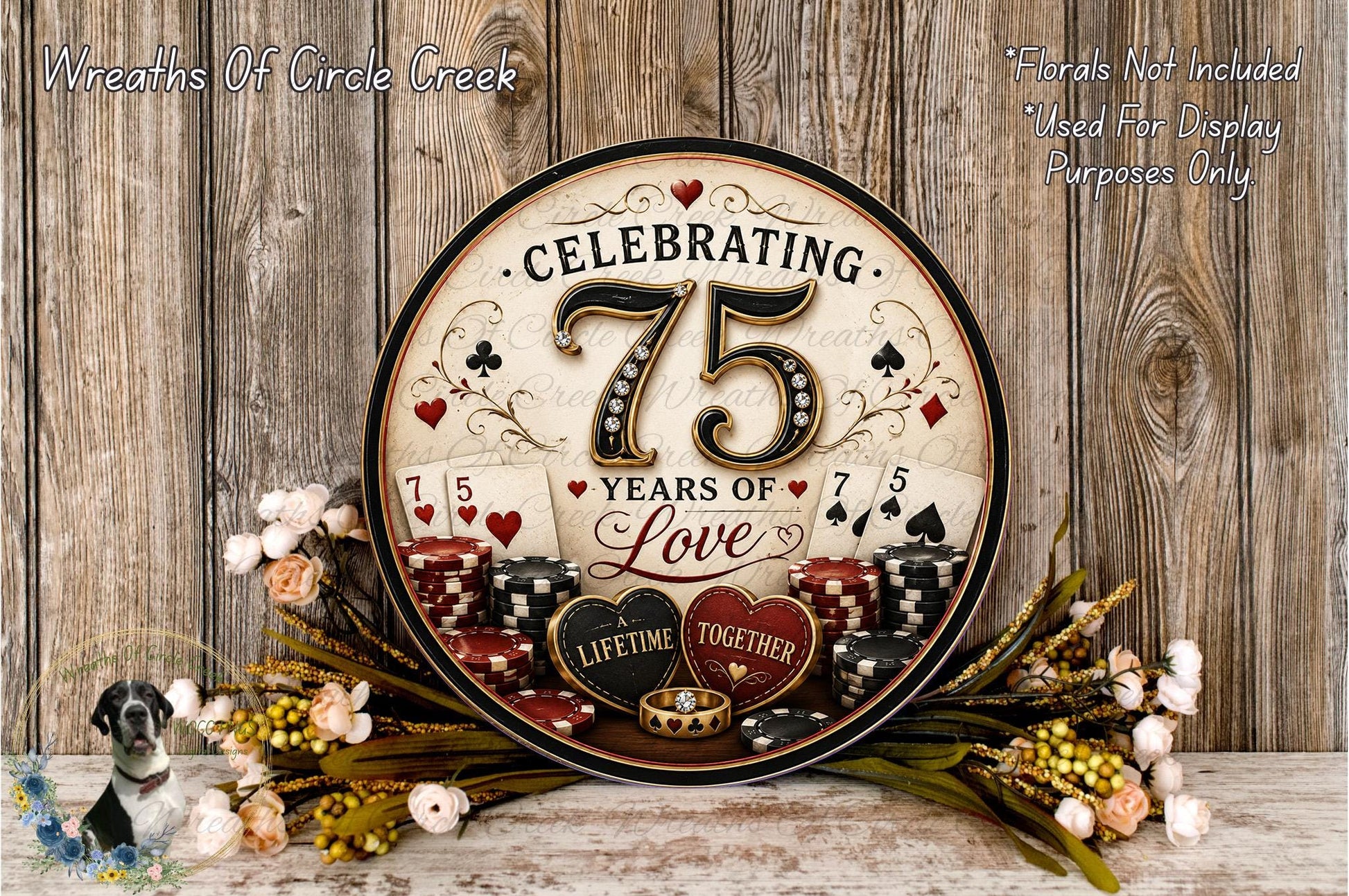 A round sign celebrating 75 years of love, with a casino-themed design and poker chips, surrounded by flowers and greenery.