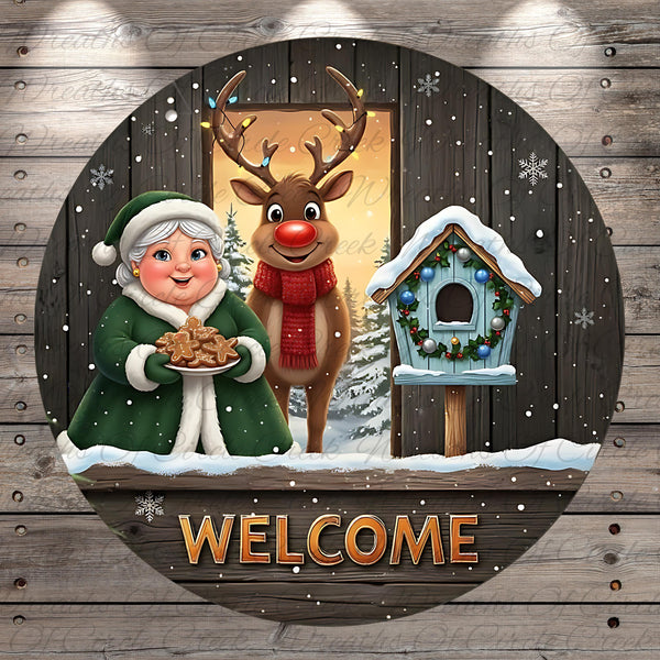 A festive winter scene with a woman holding cookies, a reindeer, and a birdhouse, all set against a snowy background. The word "WELCOME" is prominently displayed in the center of the image.