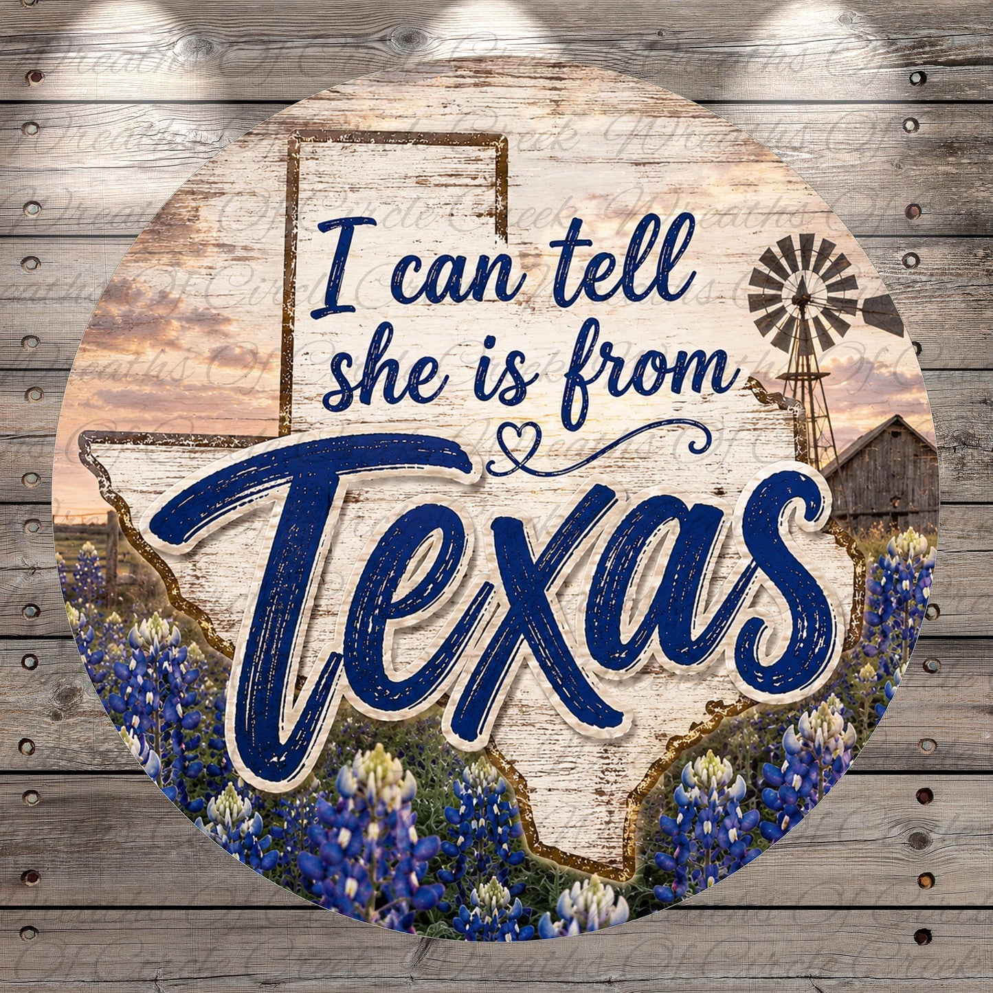 a circular sign with the text "I can tell she is from Texas" written on it. The sign is set against a background that includes a Texas state map, a windmill, and a field of blue flowers.