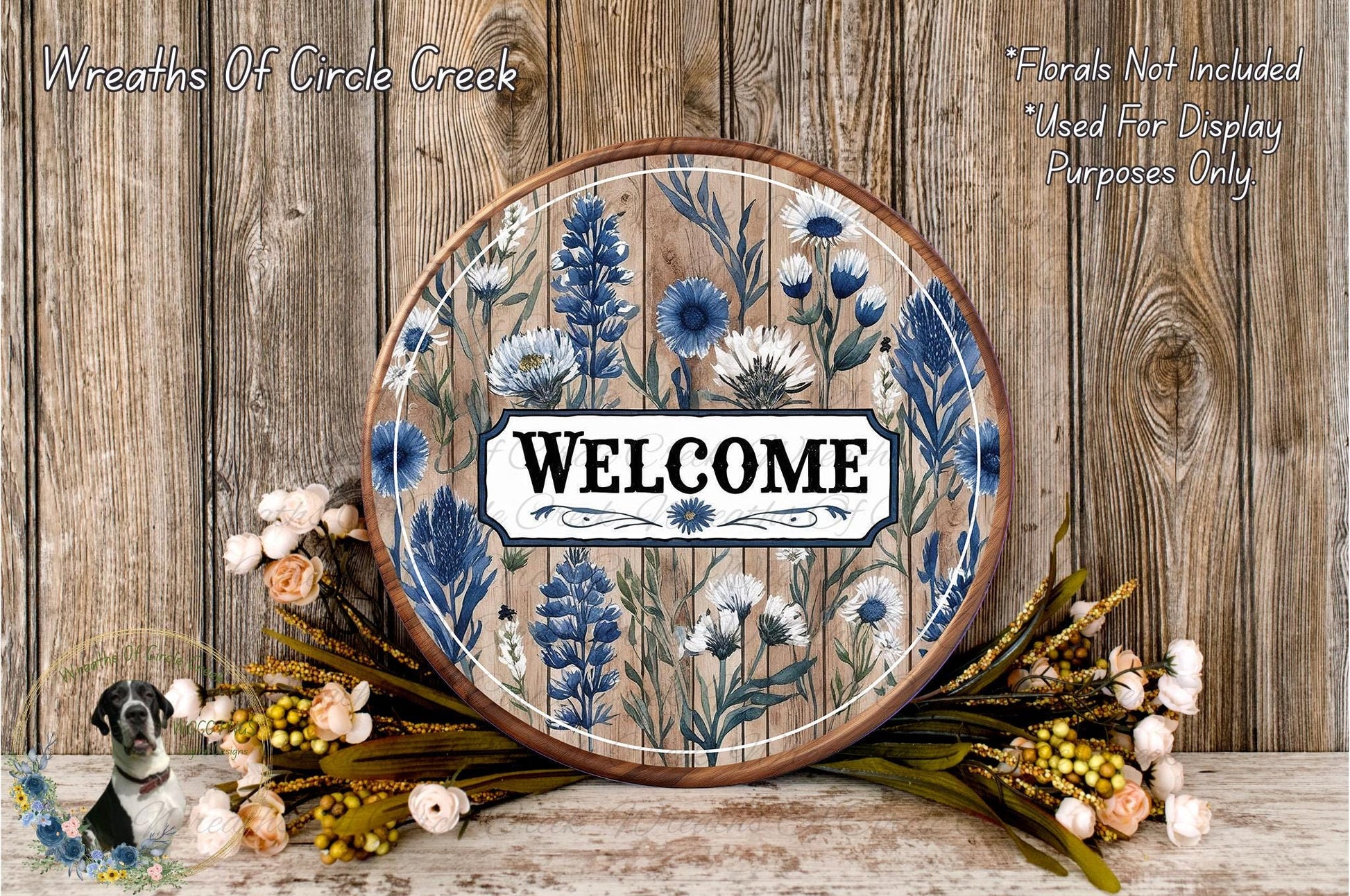 a picture of a welcome sign with flowers on it