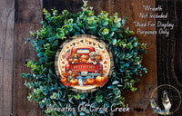 A wreath made of green leaves and pumpkins, with a red truck and dogs on it, and a text overlay that says "Wreath Not Included * Used For Display Purposes Only".