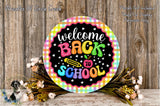 a colorful welcome back to school sign with a black background, surrounded by flowers and a wooden background.