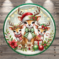 A festive Christmas scene featuring three adorable deer wearing Santa hats and scarves, surrounded by holiday decorations such as flowers, ornaments, and a gift box.