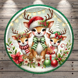 A festive Christmas scene featuring three adorable deer wearing Santa hats and scarves, surrounded by holiday decorations such as flowers, ornaments, and a gift box.