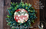 A wreath made of green and red foliage, with a circular sign that says &quot;Merry Christmas&quot; in the center.