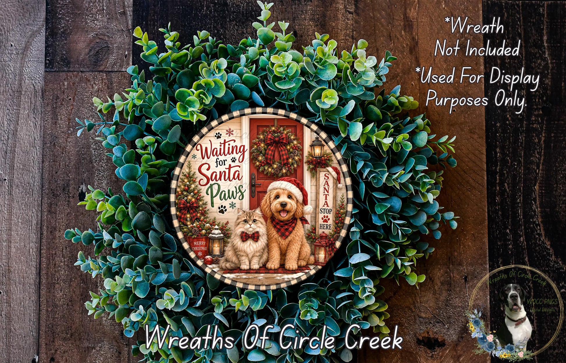 A wreath made of green leaves and featuring a dog and a cat, with a Santa Claus sign and the text "Waiting for Santa Paws".