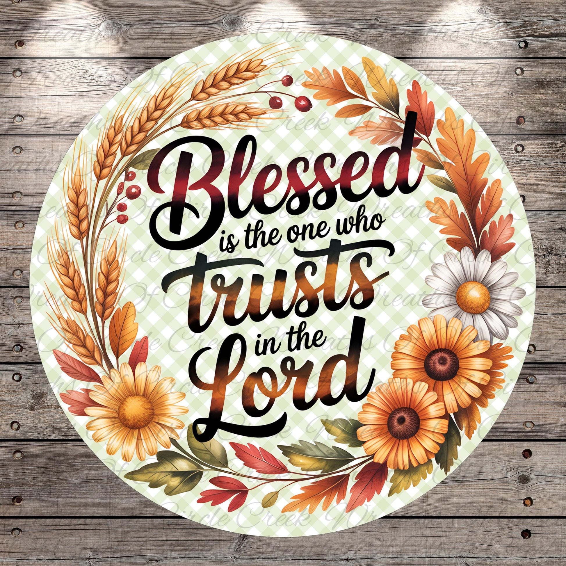 A circular design with a floral border and text that reads "Blessed is the one who trusts in the Lord".