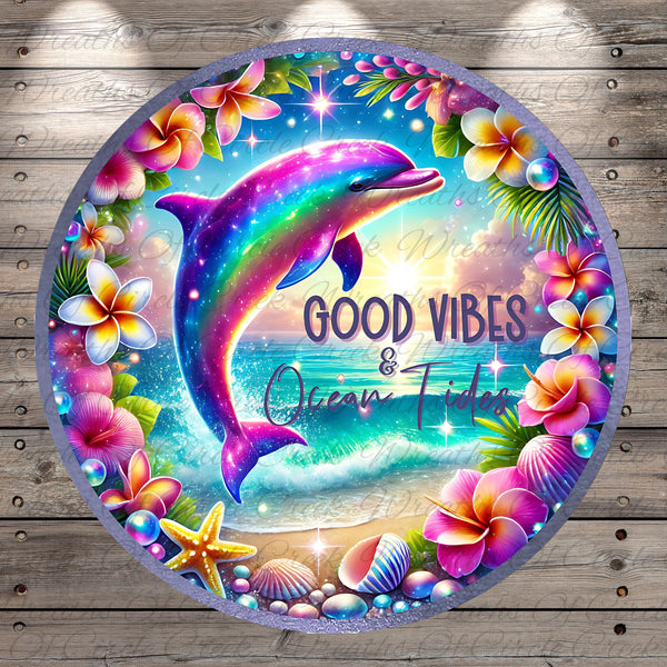 A colorful, circular design featuring a dolphin surrounded by tropical flowers, seashells, and starfish, with the text "GOOD VIBES & Ocean Tides" displayed prominently.