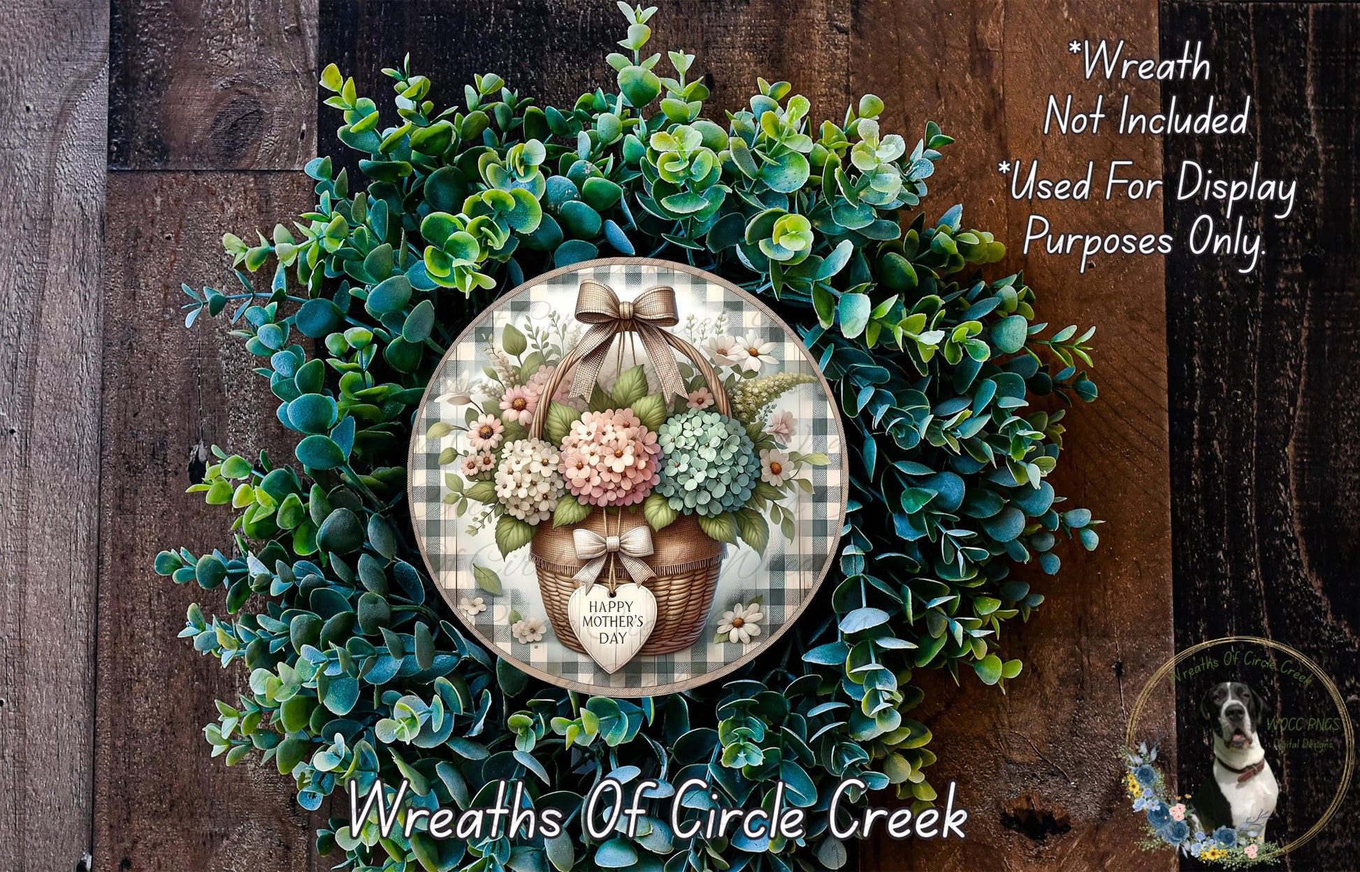 a wreath with a basket of flowers, including hydrangeas, placed on a wooden surface. The wreath is not included in the image, and it is used for display purposes only.