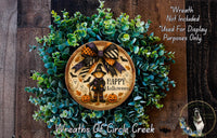 a wreath with a picture of a witch on it