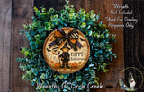 a wreath with a picture of a witch on it