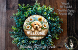 a wreath with a dog sitting in a wooden basket filled with flowers, surrounded by a lush green plant. The wreath is displayed on a wooden wall, and there is a text overlay that reads "Welcome Wreath Not Included Used For Display Purposes Only".