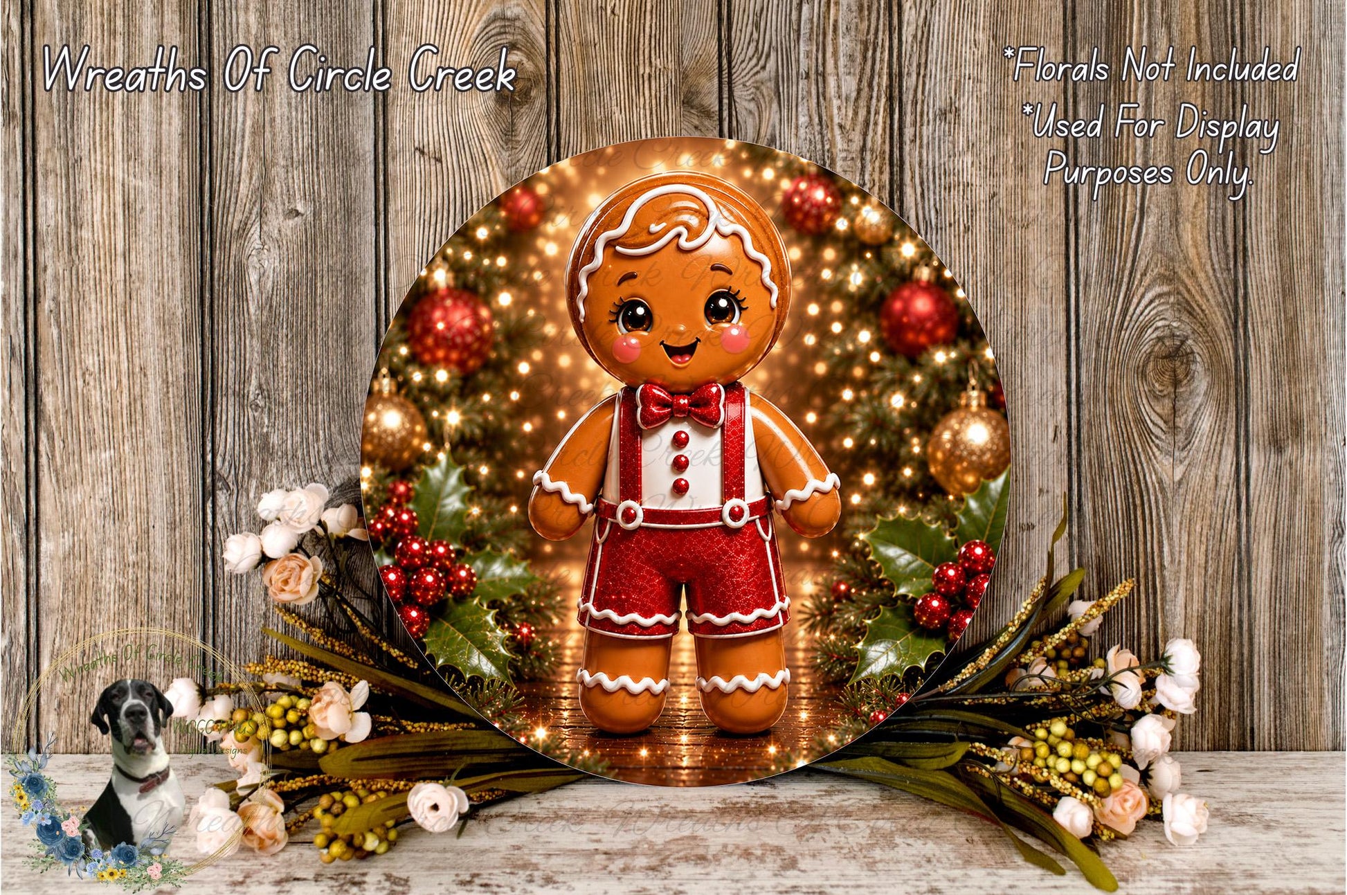 A gingerbread man figure is displayed in a wreath, surrounded by holiday decorations such as flowers and greenery, against a wooden background.