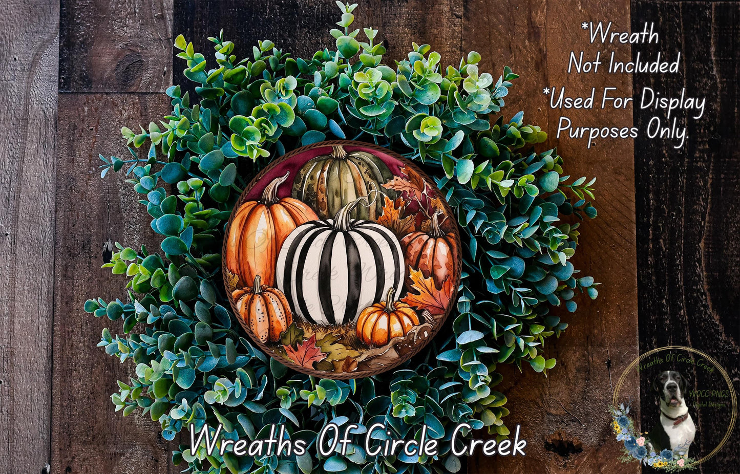 a wreath with pumpkins and gourds painted on it