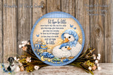 A decorative plate with a baby carriage and two baby ducks, surrounded by flowers and a blue and white checkered border. The plate has a message that reads "Let them be little, cause they're only that way for a while. Give them hope, give them praise, let them love every little thing, let them cry, let them grieve, let them sleep in the middle, just let them be little."