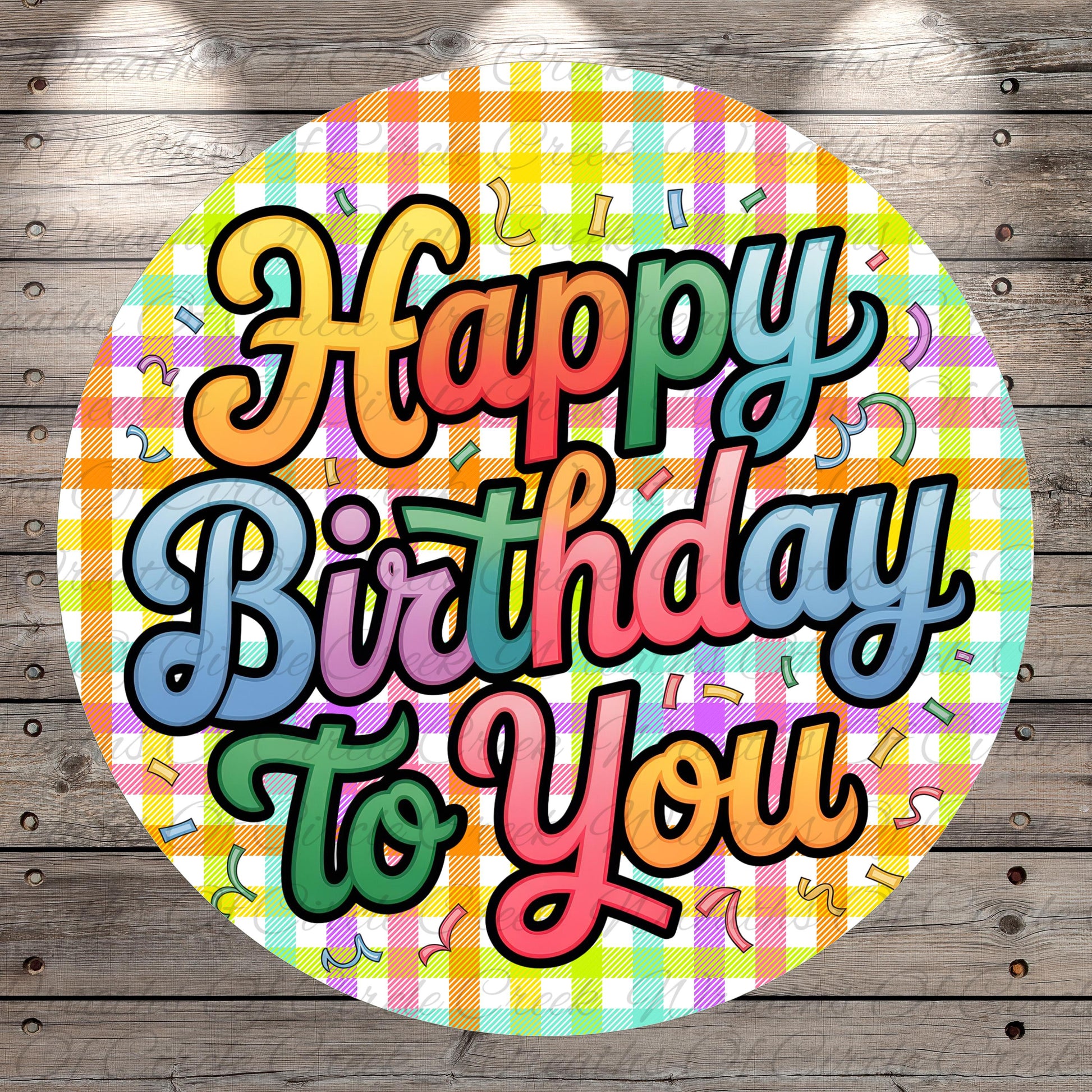 A colorful birthday greeting with the text "Happy Birthday to You" displayed on a circular background with a checkered pattern and confetti-like elements.