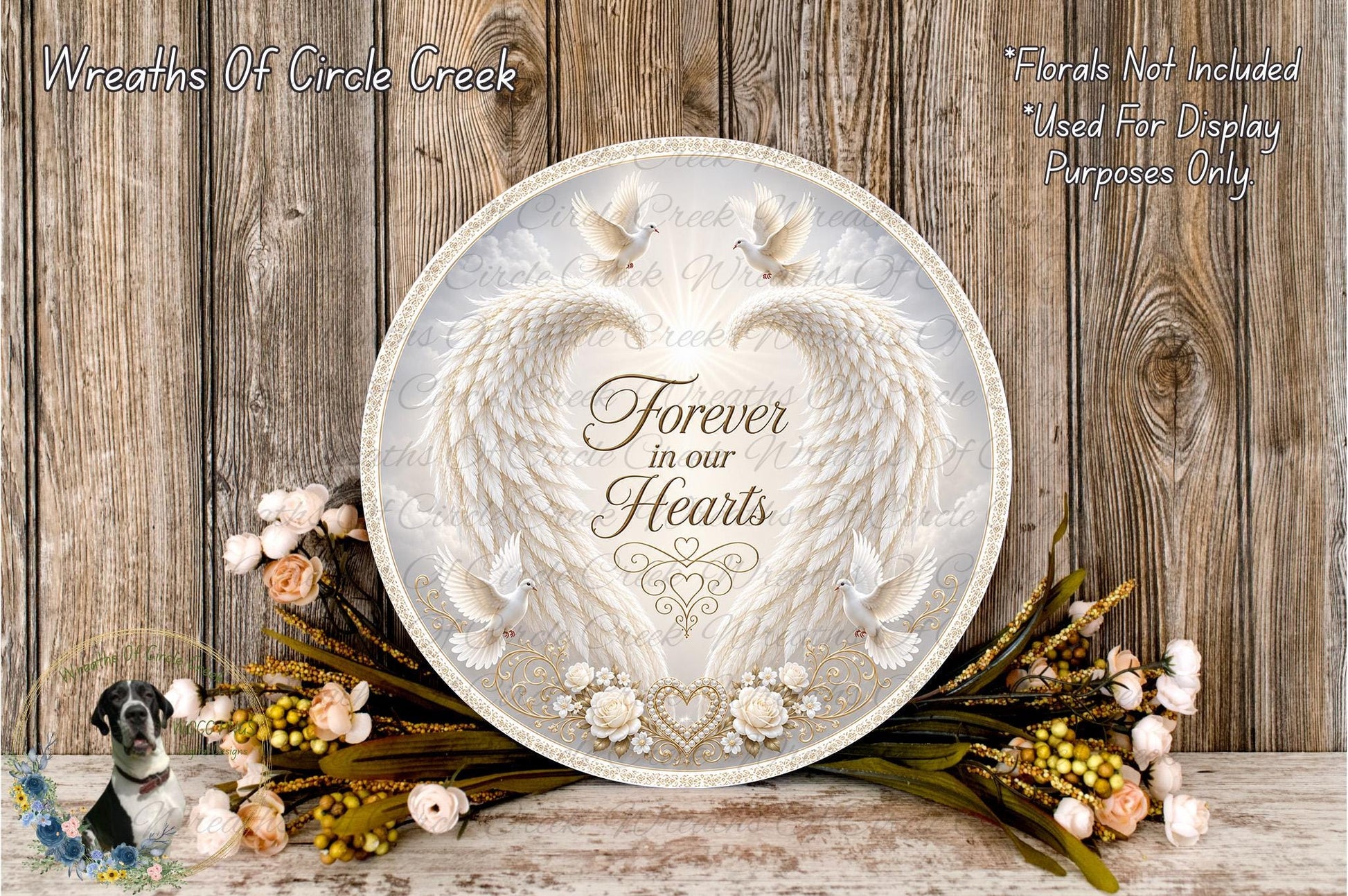 a round sign with a floral design and the text "Forever in our hearts" surrounded by a wreath of flowers and greenery.
