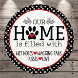 The image is a circular sign with the text "OUR HOME is filled with WET Noses WAGING TAILS KISSES LOVE" written on it.