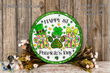 A circular sign with a green border and a white background, featuring a leprechaun hat, a four-leaf clover, and paw prints, surrounded by a floral arrangement and a wooden background.
