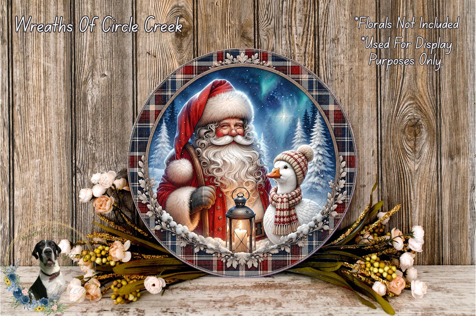 A decorative plate featuring a painting of Santa Claus and a duck, surrounded by a floral arrangement and a lantern, set against a snowy winter landscape.