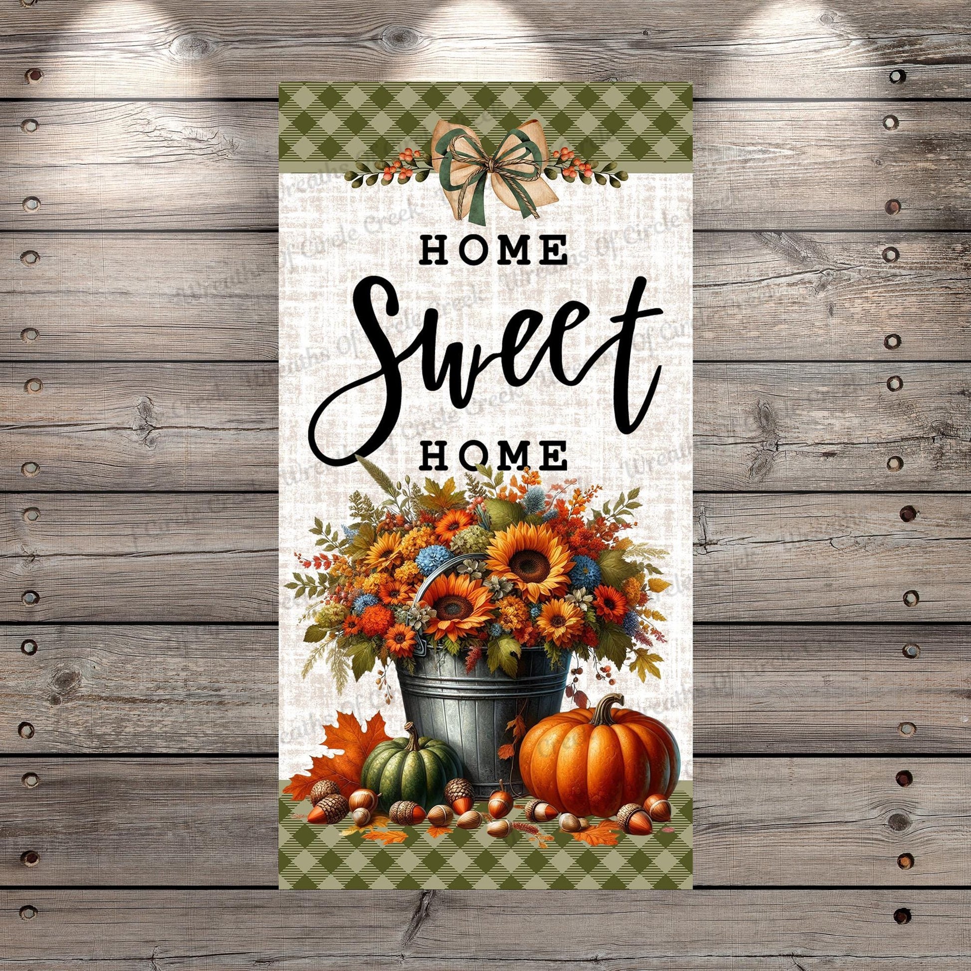 a sign that says home sweet home with pumpkins and sunflowers
