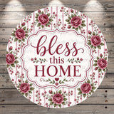 A round floral-patterned sign with the text "bless this home" in a decorative font.