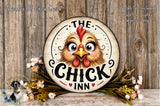 a decorative sign with a cartoon chicken face, surrounded by flowers and placed on a wooden surface.