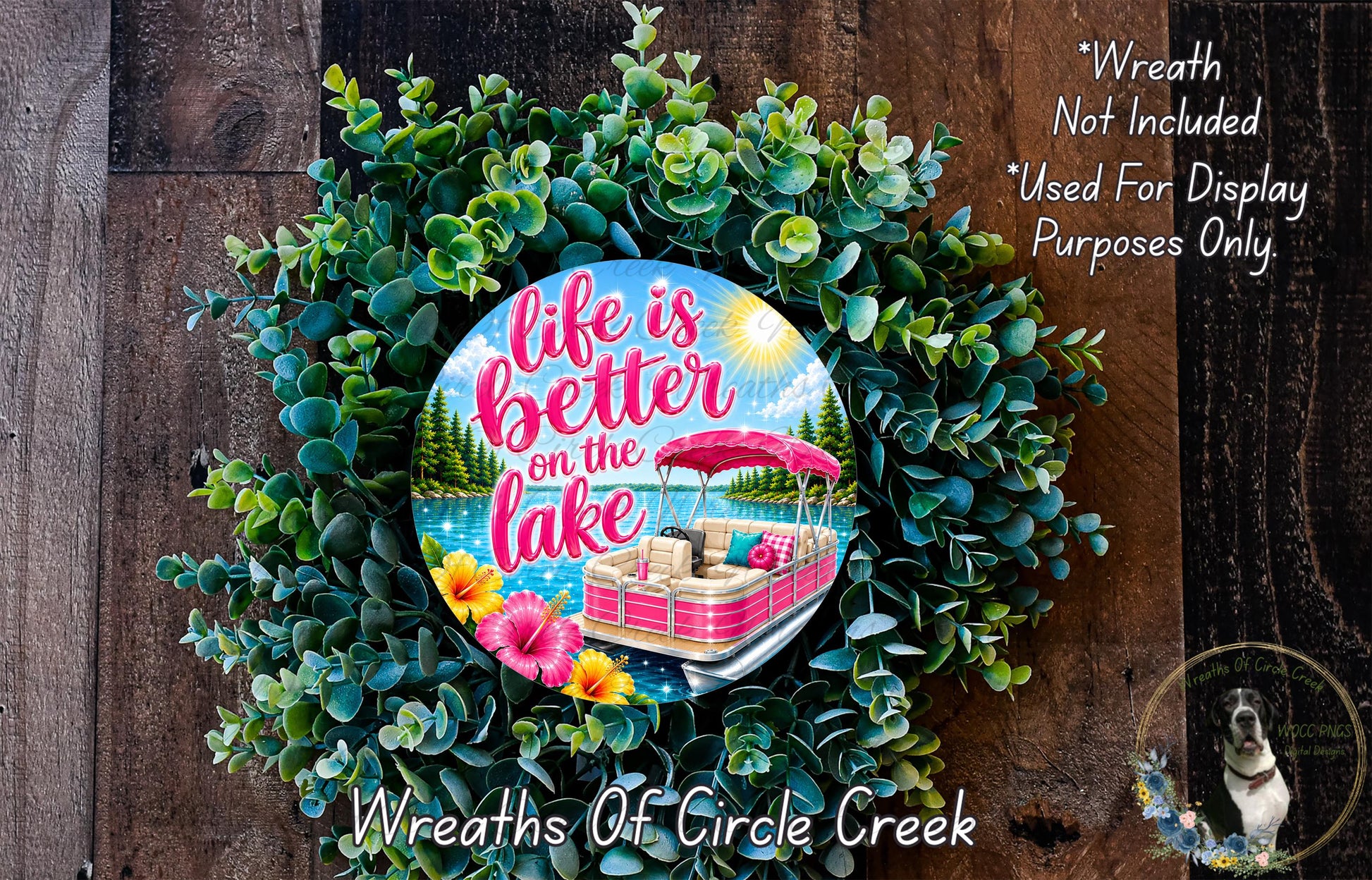 a wreath with a decorative design and a message about life being better on the lake.