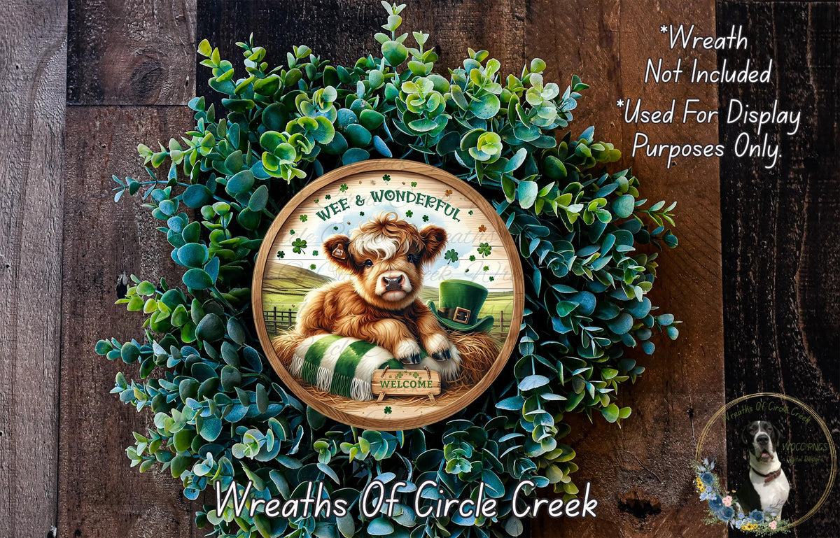 A wreath made of green leaves and a brown cow wearing a green hat, with the text "Wreath Not Included * Used For Display Purposes Only" and "Wreaths Of Circle Creek" written around it.