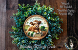 A wreath made of green leaves and a brown cow wearing a green hat, with the text "Wreath Not Included * Used For Display Purposes Only" and "Wreaths Of Circle Creek" written around it.