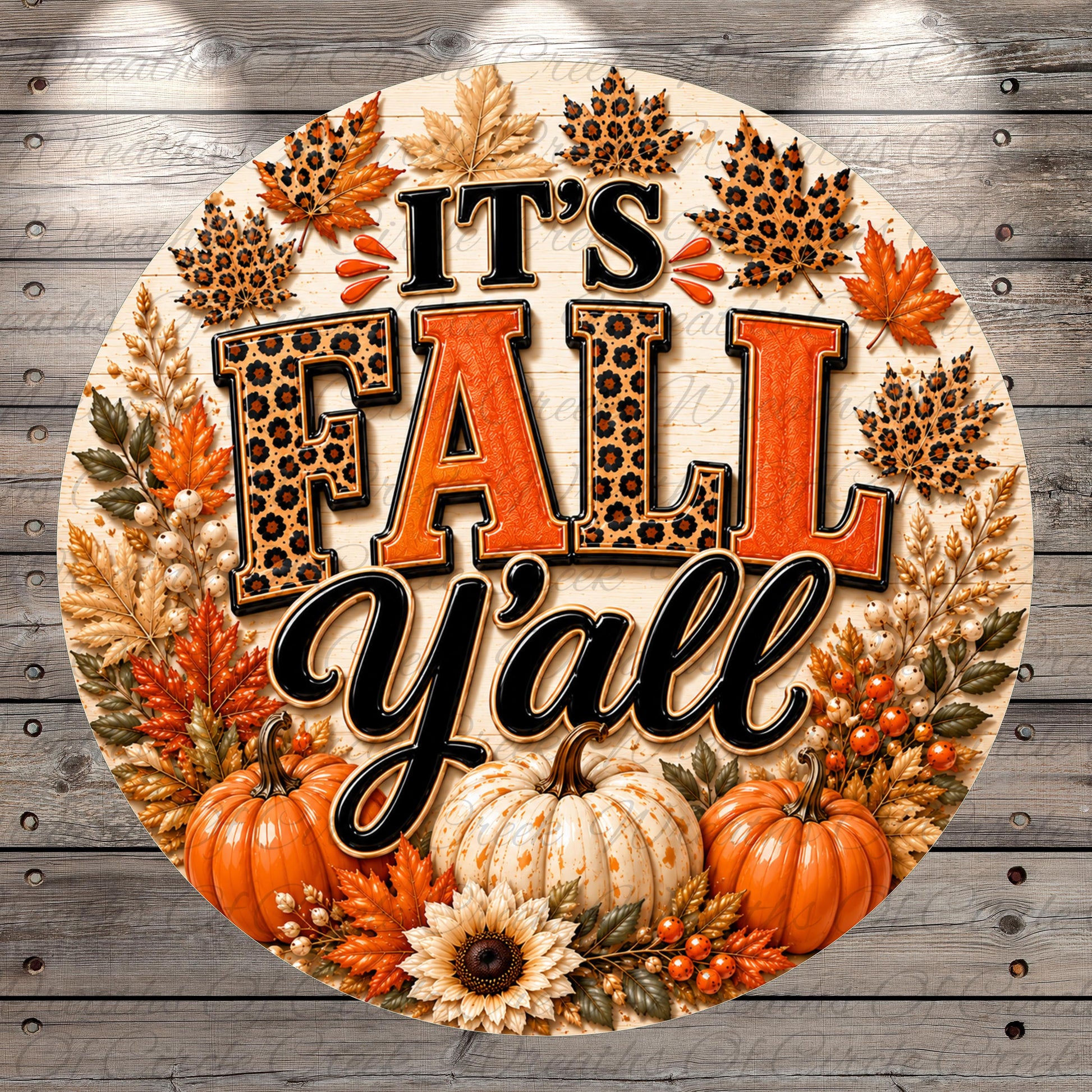 A decorative circular sign with the text "It's Fall Y'all" surrounded by autumn-themed elements such as leopard print leaves, pumpkins, and sunflowers.