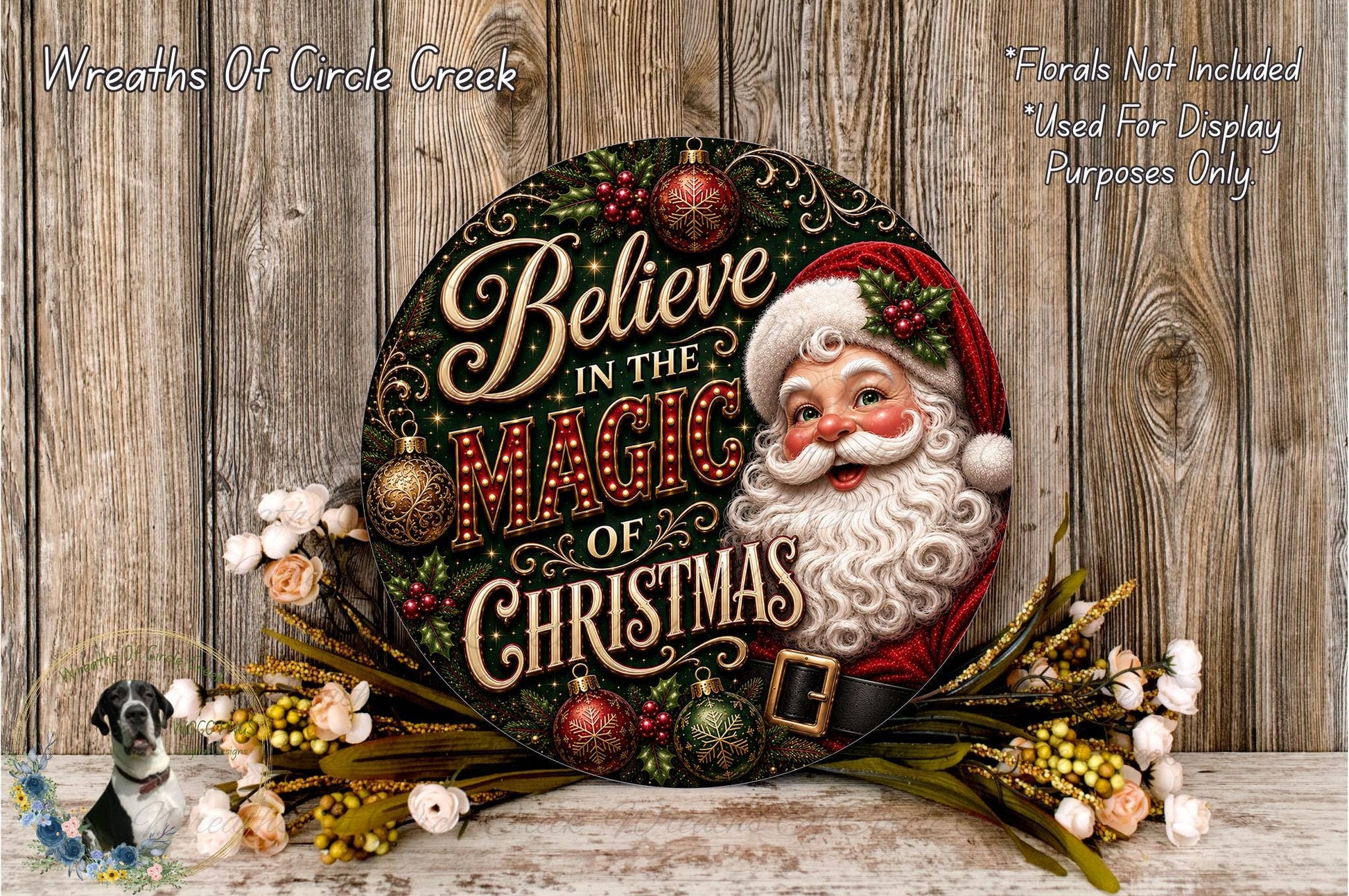 A decorative Christmas wreath with a Santa Claus face and the text "Believe in the Magic of Christmas" displayed on it, surrounded by ornaments and greenery.