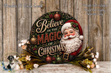 A decorative Christmas wreath with a Santa Claus face and the text "Believe in the Magic of Christmas" displayed on it, surrounded by ornaments and greenery.