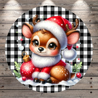 A cute cartoon deer wearing a Santa hat and holding a Christmas ornament, surrounded by snow and greenery, against a black and white checkered background.
