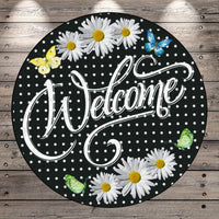 a welcome sign with daisies and butterflies