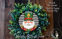 A wreath featuring a nutcracker face surrounded by greenery, with a text overlay that reads "Wreath Not Included * Used For Display Purposes Only" and "Wreaths of Circle Creek".