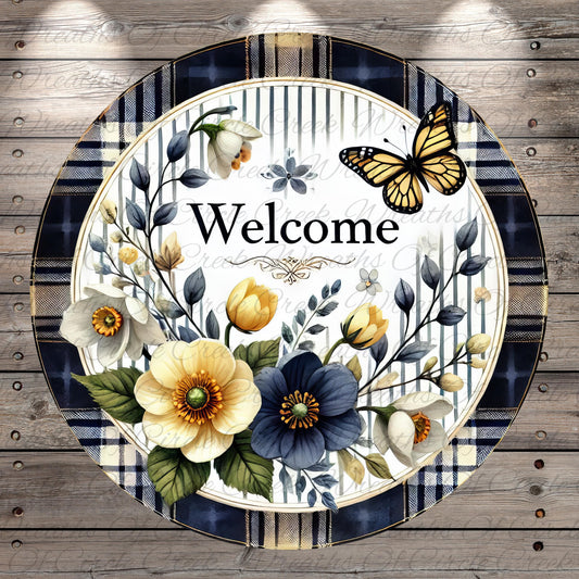 A decorative round sign with a floral border and a butterfly, surrounded by various flowers and leaves. The word "Welcome" is prominently displayed in the center of the sign.